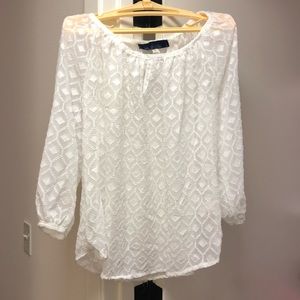 Francesca’s white blouse